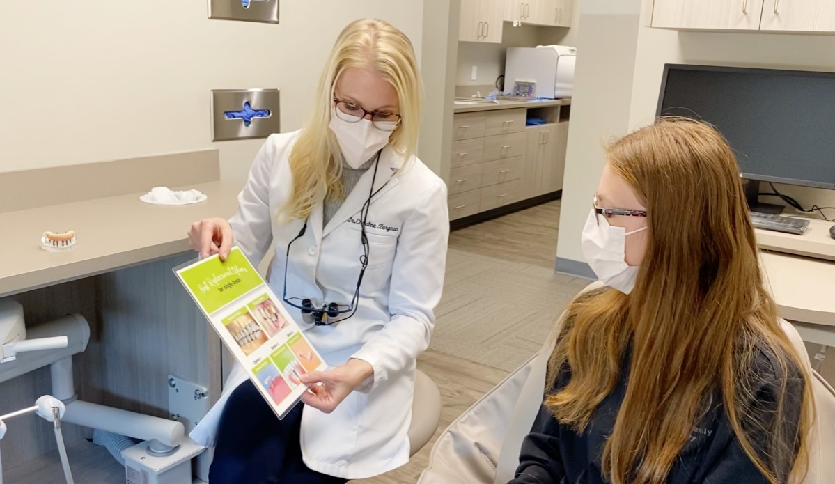 Dr. Christine Bergman with a patient at her South Lincoln Dental Clinic, South Lincoln Family Dentistry.